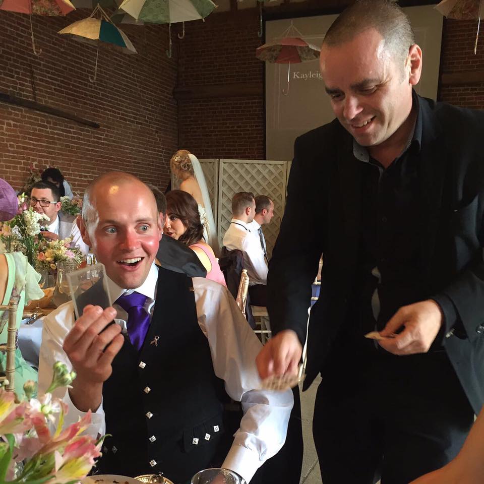Close-up magician at Crondon Park Essex wedding in the Baronial Hall