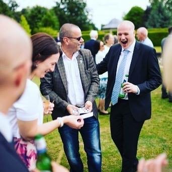 Wedding guests reacting to magic at Houchins Barn wedding venue in Essex