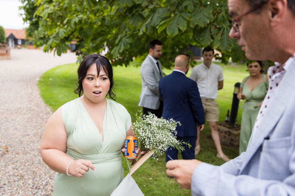 Bridesmaid reacting to wedding magician at Vaulty Manor Essex