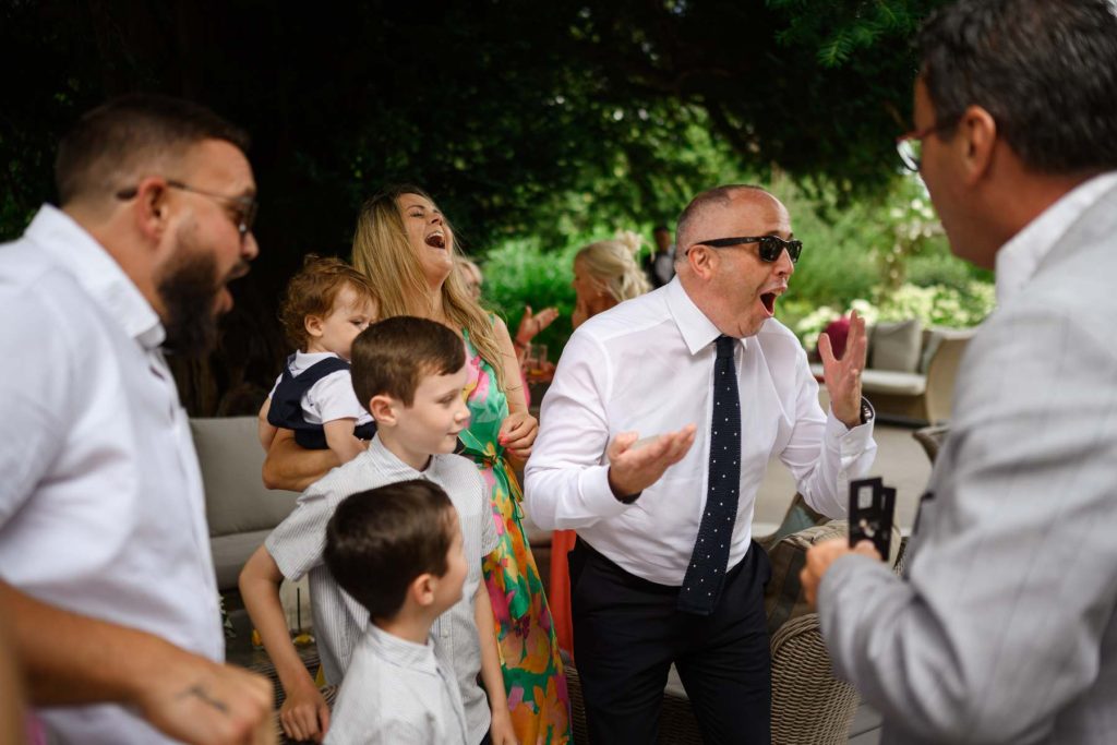 Guests amazed by wedding magician at Gaynes Park Essex barn venue
