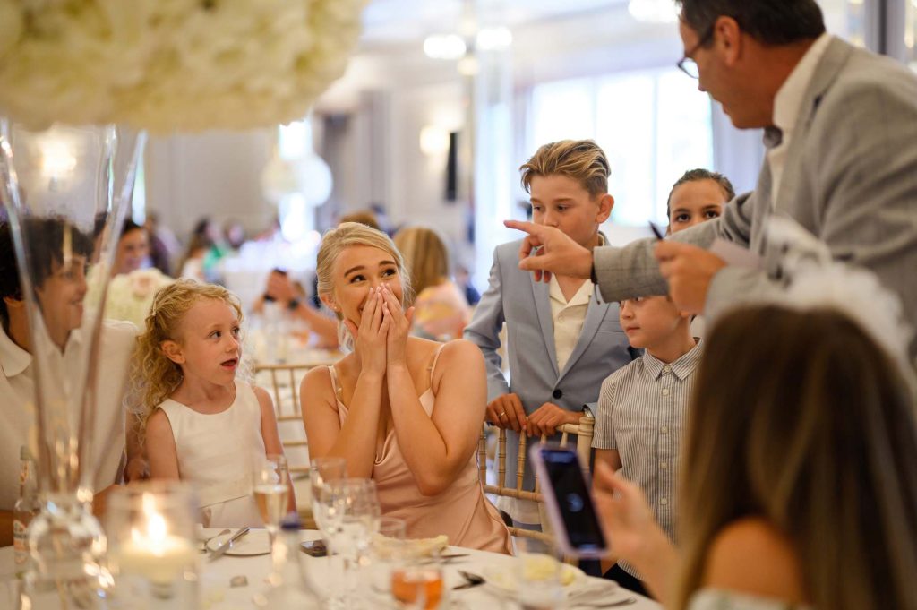 Close-up magician performing during a wedding at Down Hall Hotel & Spa in Essex