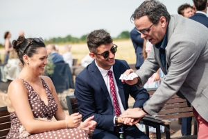 Andy Magicman performing close-up card magic for guests, showcasing professional magician services for interactive events and parties across the UK.