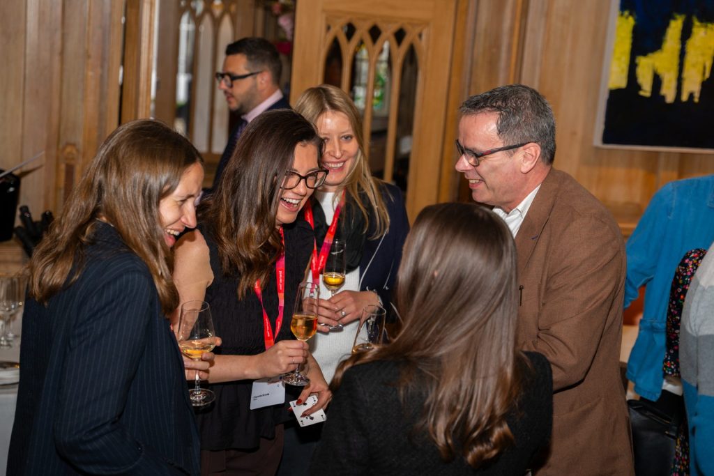 Award-winning corporate magician Andy Magicman performing interactive close-up magic for guests at a corporate networking event in the UK.