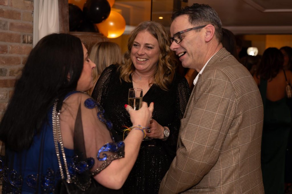 Guests reacting to close up magic at corporate event