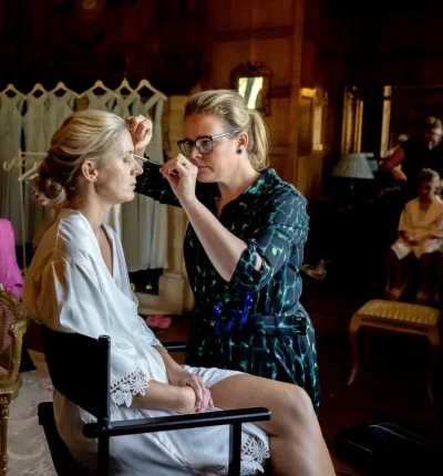Laura Cartwright doing make up on a bride